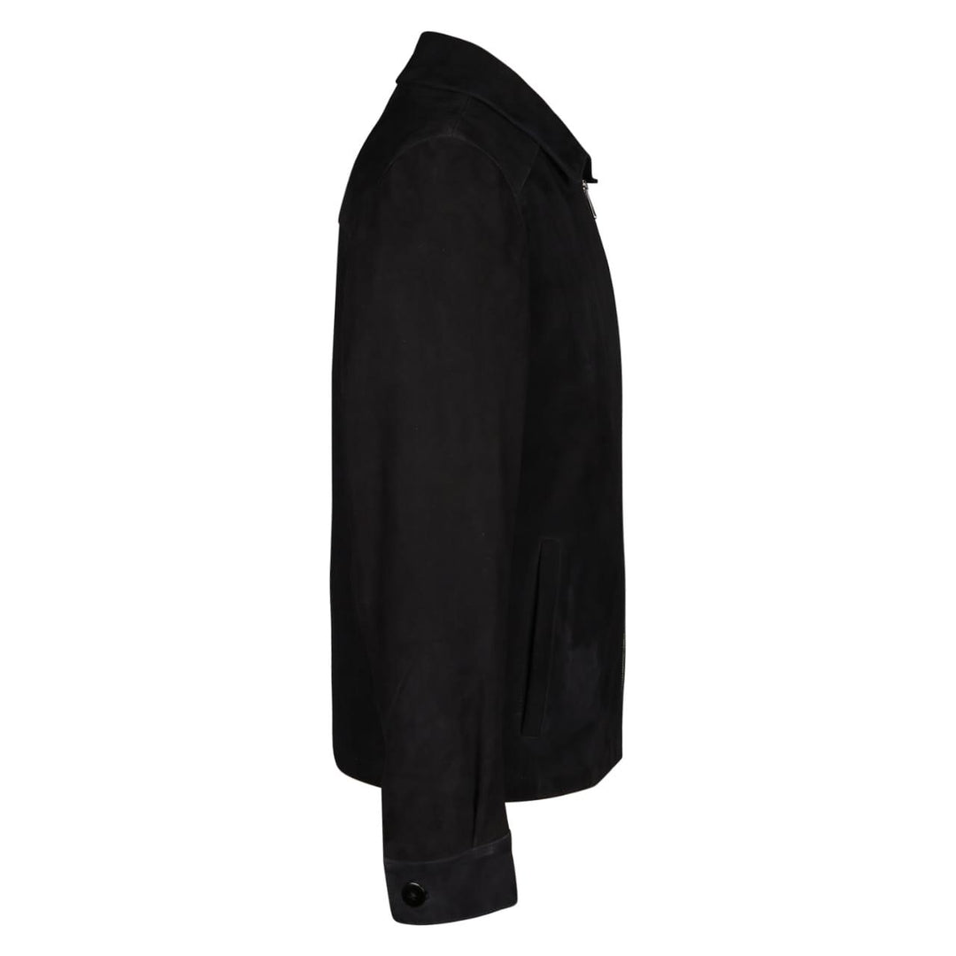 Back view of a man wearing a black bomber jacket with fur trim.