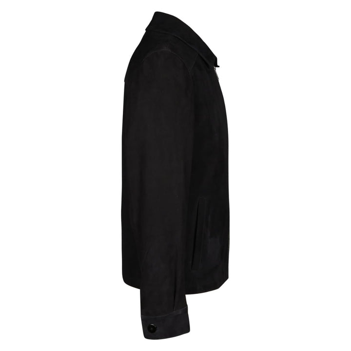 Back view of a man wearing a black bomber jacket with fur trim.