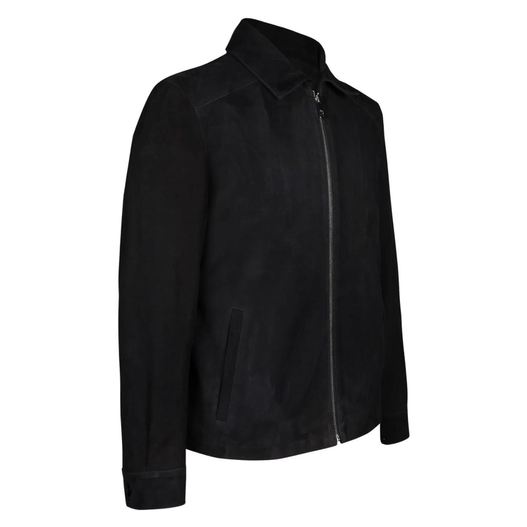 Side view of a man wearing a black bomber jacket with fur trim.