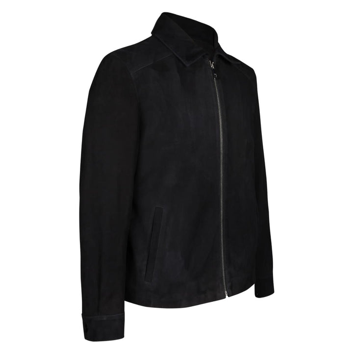 Side view of a man wearing a black bomber jacket with fur trim.