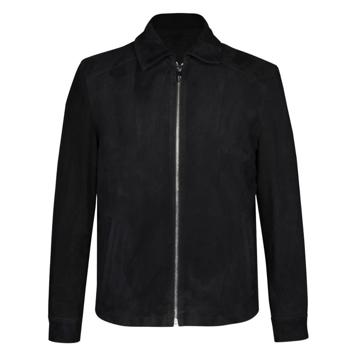 Man wearing a zipped-up black bomber jacket with fur trim.