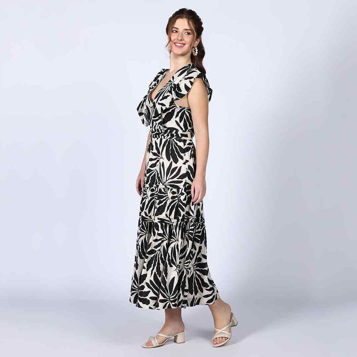 Women's black ivory palm-print lurex maxi dress by Saint, back view.