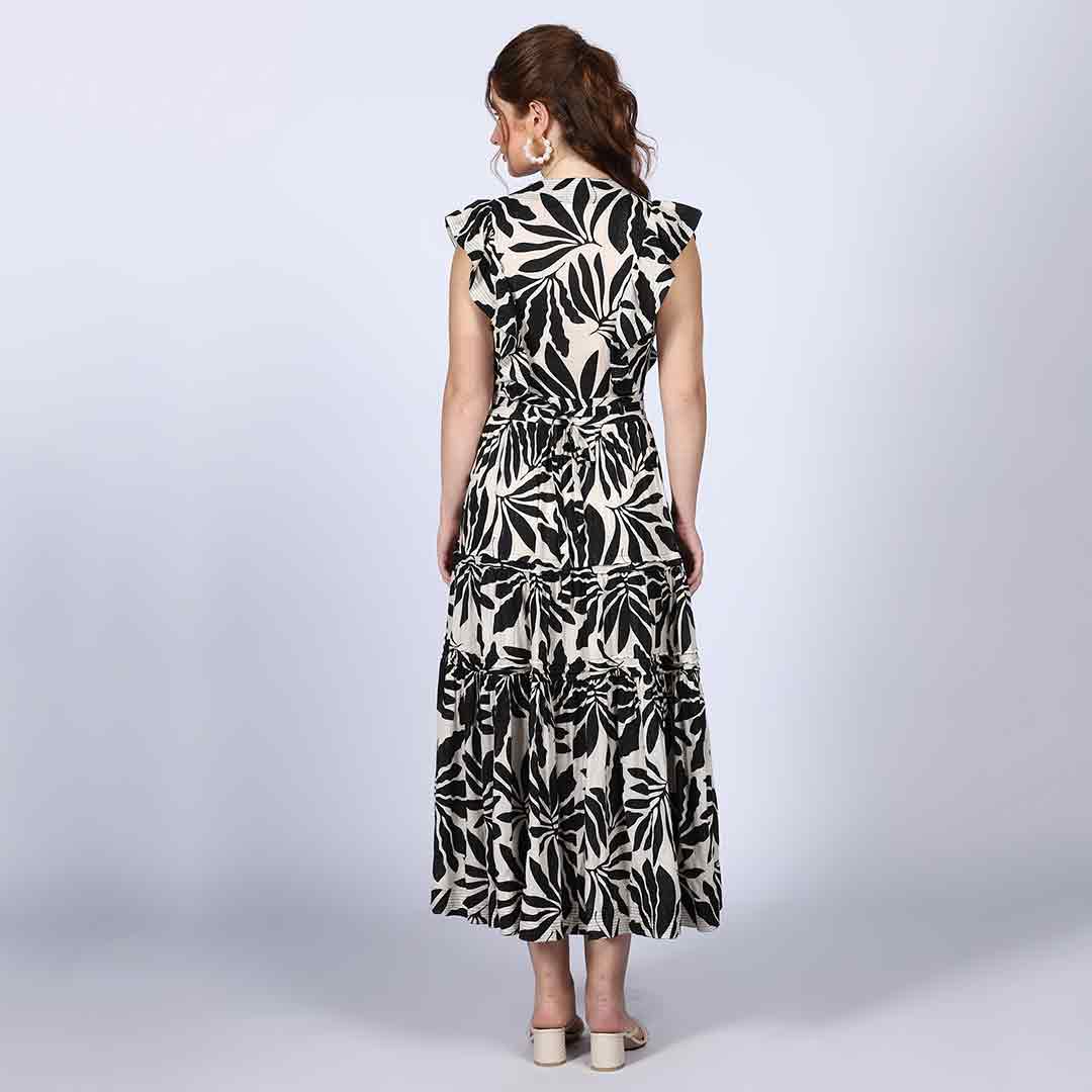 Saint black ivory palm-print lurex maxi dress for women UK, front view styled with a handbag.