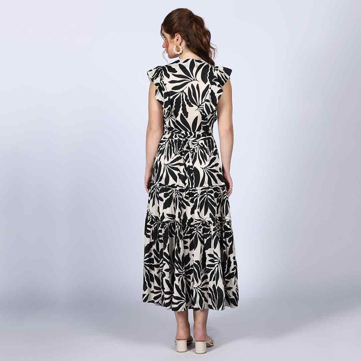 Saint black ivory palm-print lurex maxi dress for women UK, front view styled with a handbag.