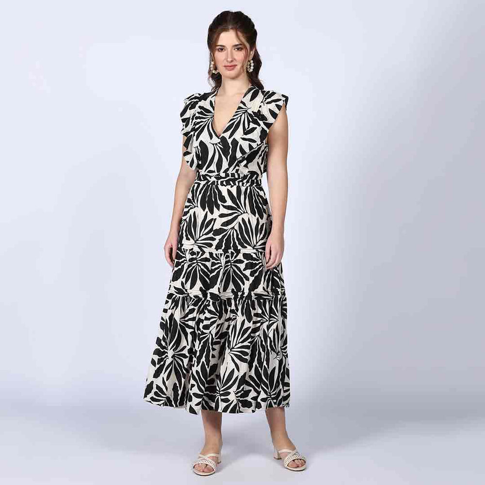Women's black ivory palm-print lurex maxi dress by Saint, side view showing floor-length hem.