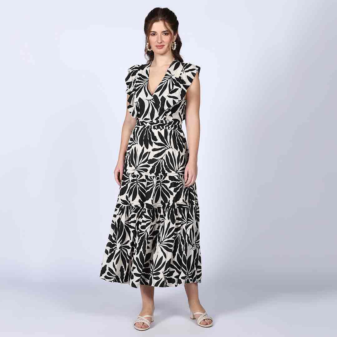 Women's black ivory palm-print lurex maxi dress by Saint, side view showing floor-length hem.