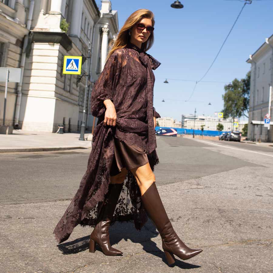 Women's brown block heel knee high boots by Saint Celia, styled street-style lifestyle shot