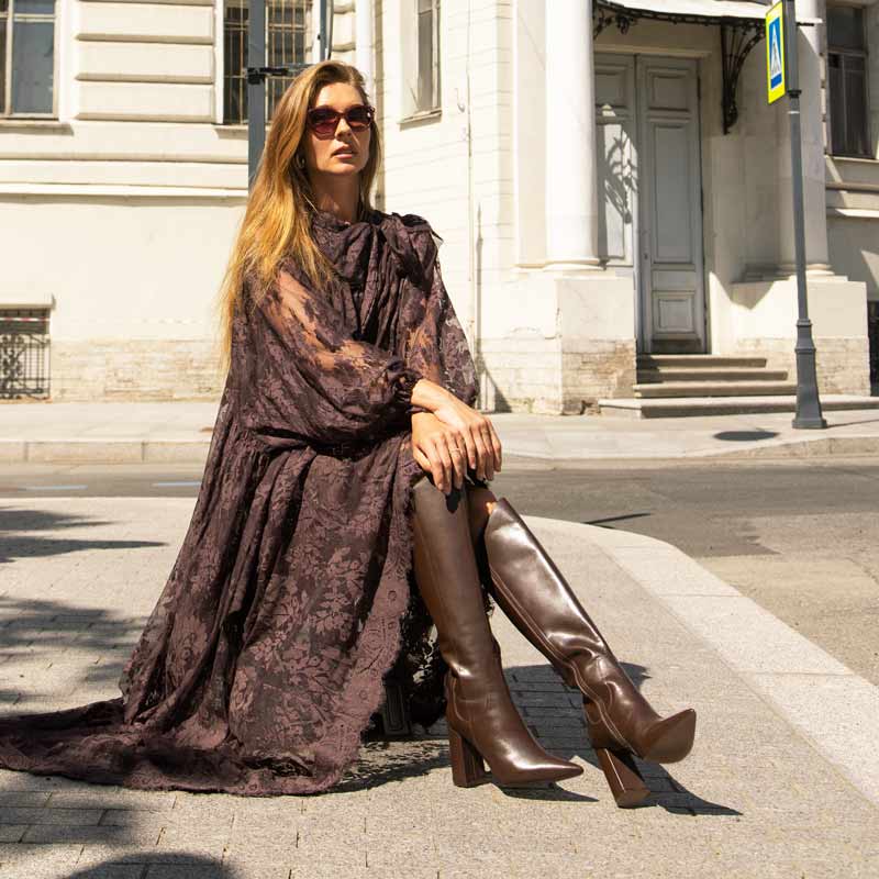 Women's brown block heel knee high boots by Saint Celia, second editorial lifestyle shot