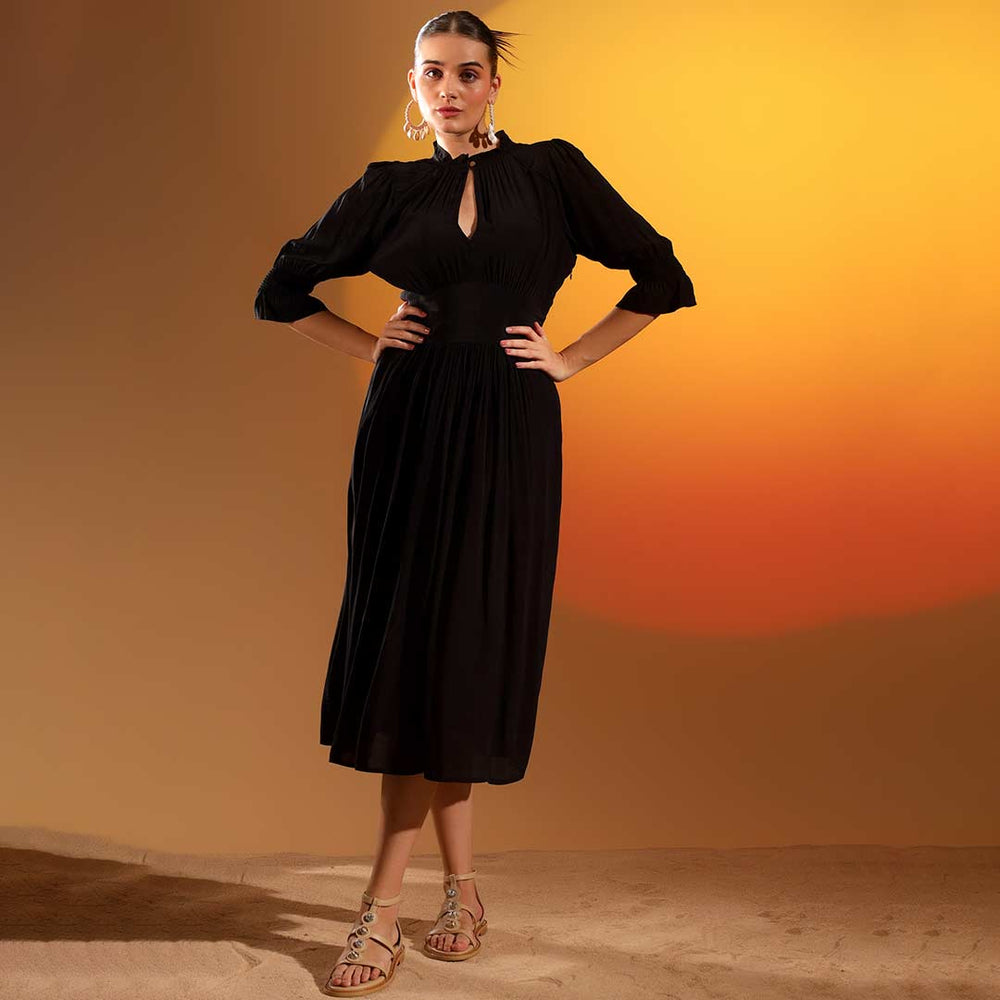 Women's coal black solid viscose midi dress by Saint, front view showing mid-calf hem.