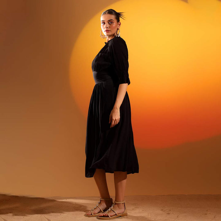 Saint coal black solid viscose midi dress for women UK, side view.