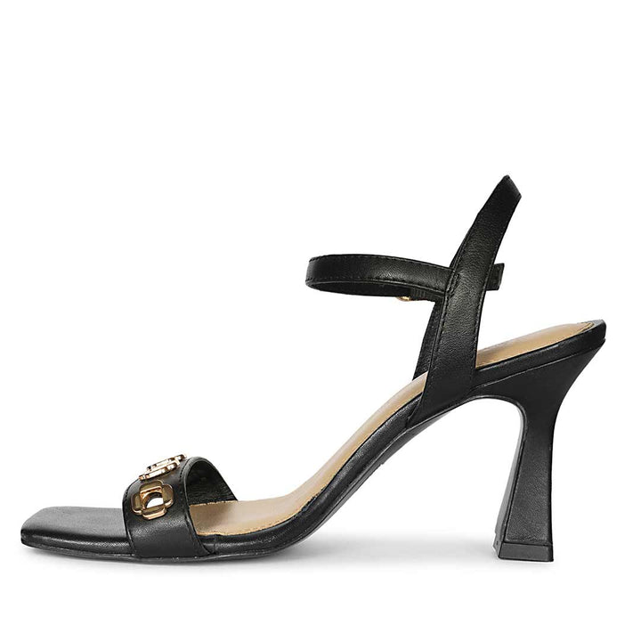 Saint Dahlia gold flower eyelets black leather heels, angled view