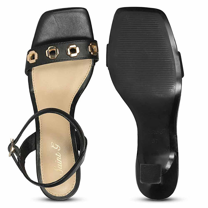 Saint Dahlia gold flower eyelets black leather heels, sole view
