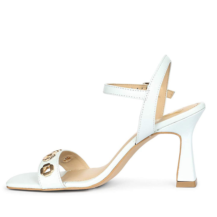 Saint Dahlia gold flower eyelets sky leather heels, angled view