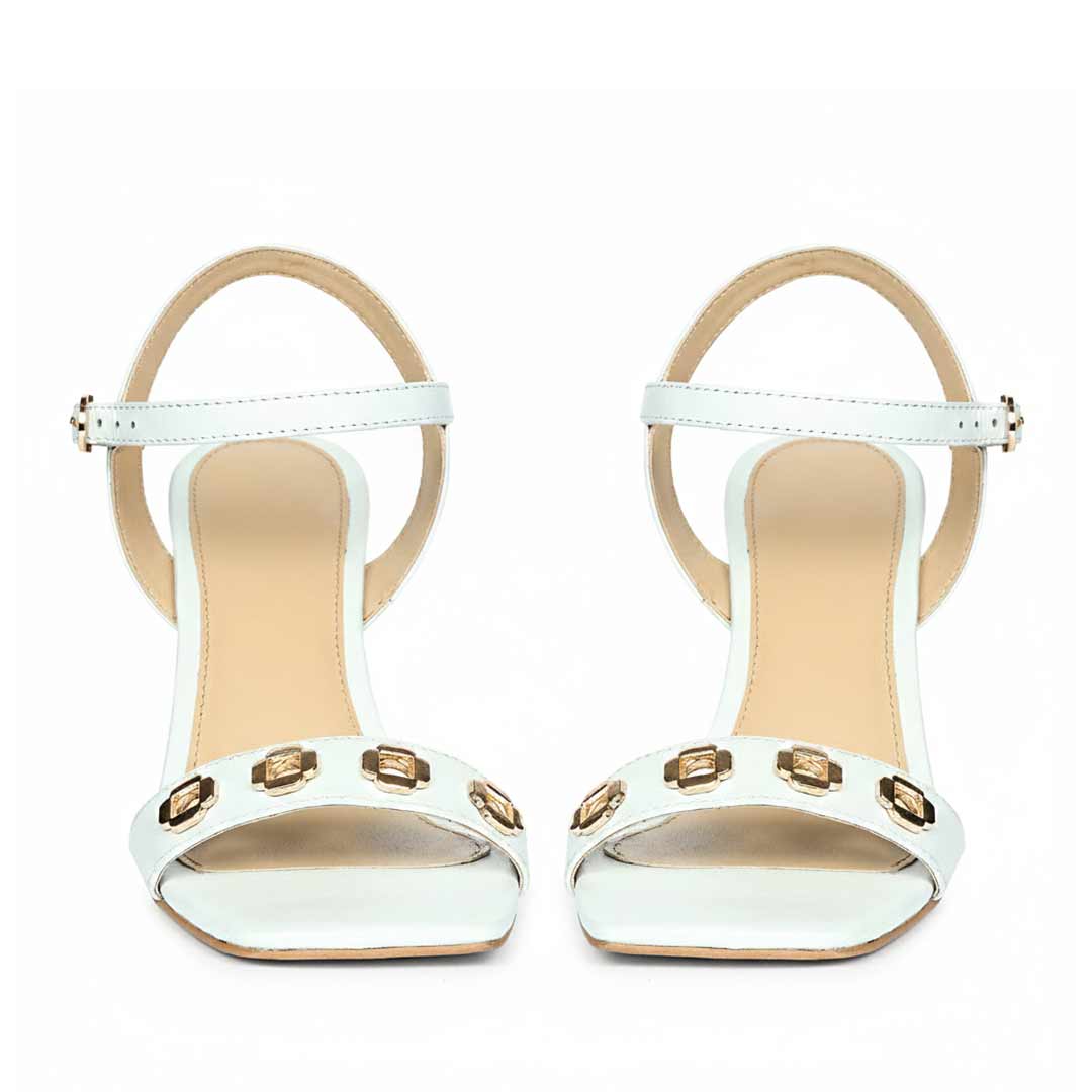 Saint Dahlia sky leather heels, front view of gold flower eyelets