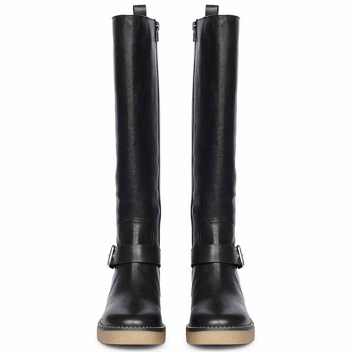 Women's Saint Dahlia black leather long boots, front pair view of silver buckle strap