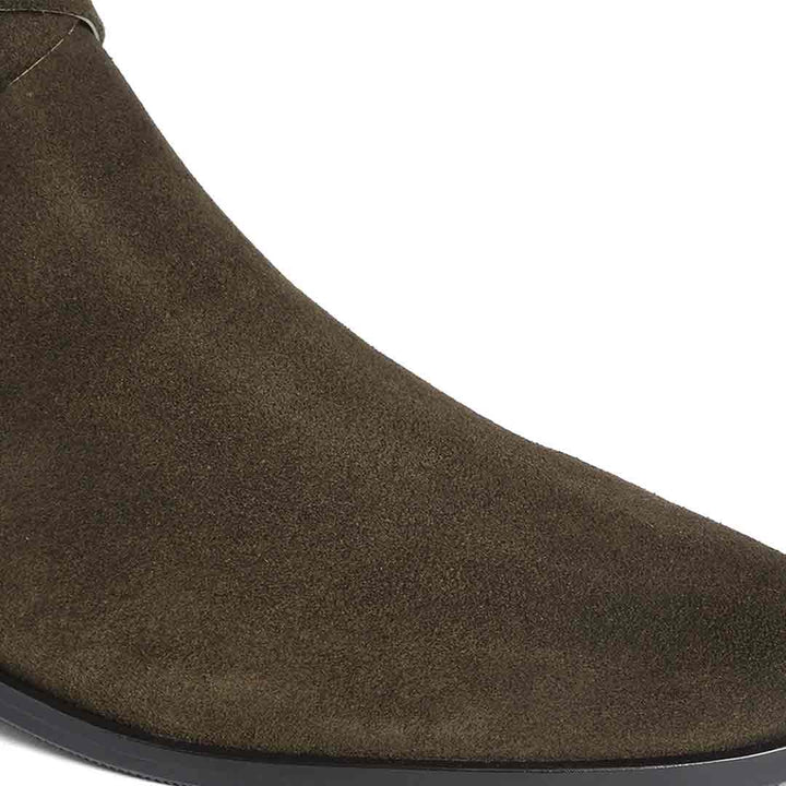 Close-up of olive suede texture on Saint Damaris knee high boots