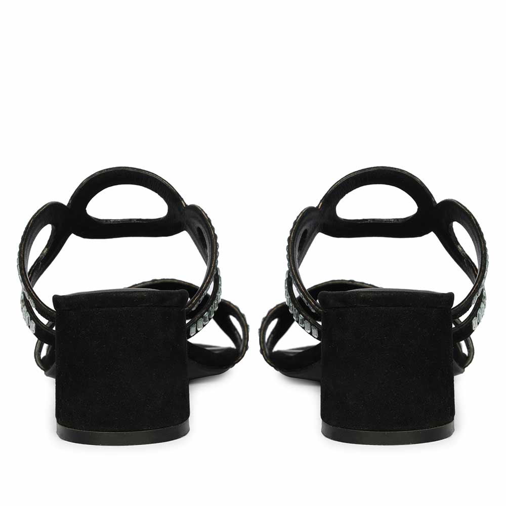 Black low block heels styled on model – back view