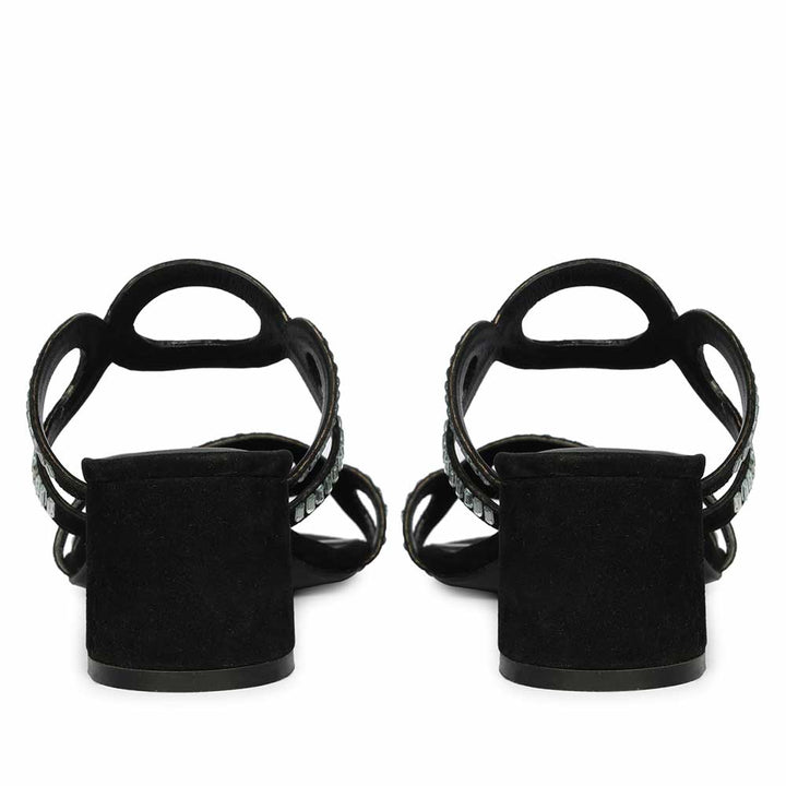 Black low block heels styled on model – back view