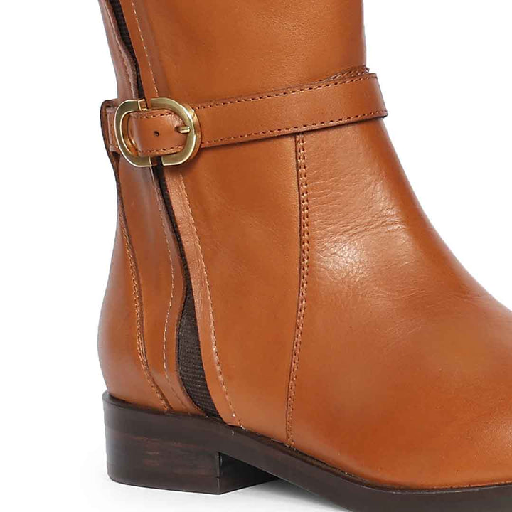 Close-up of gold buckle strap on Saint Darla dual gold buckle tan leather long boots