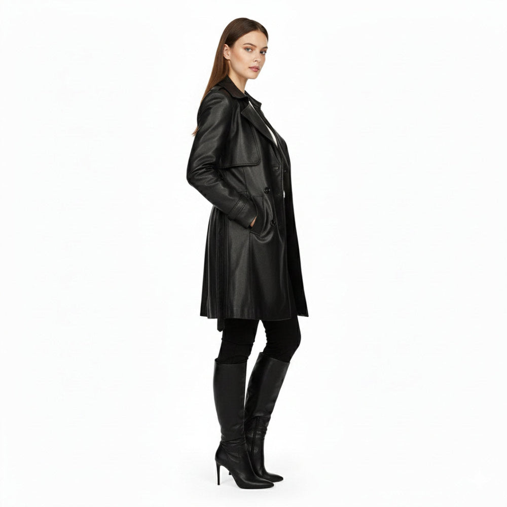 Women's black leather trench coat UK by Saint Davina, side view showing belted waist