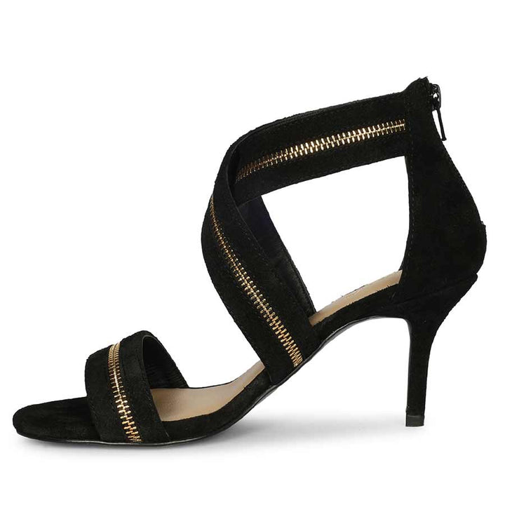 Saint Delilah black suede stiletto heels, angled side view showing heel and back zip