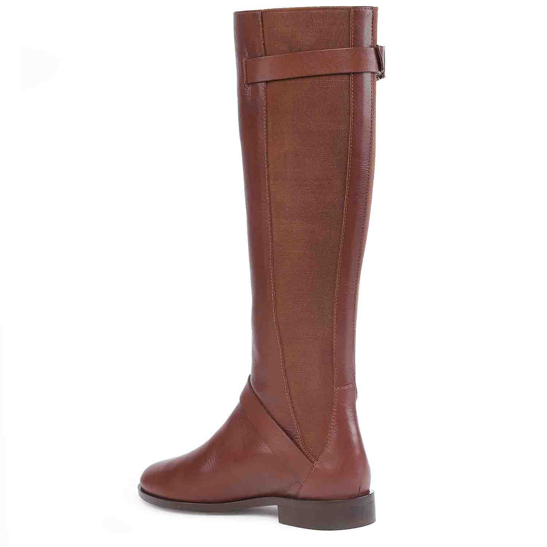 Women's tan leather knee high boots, angled back view of buckle strap