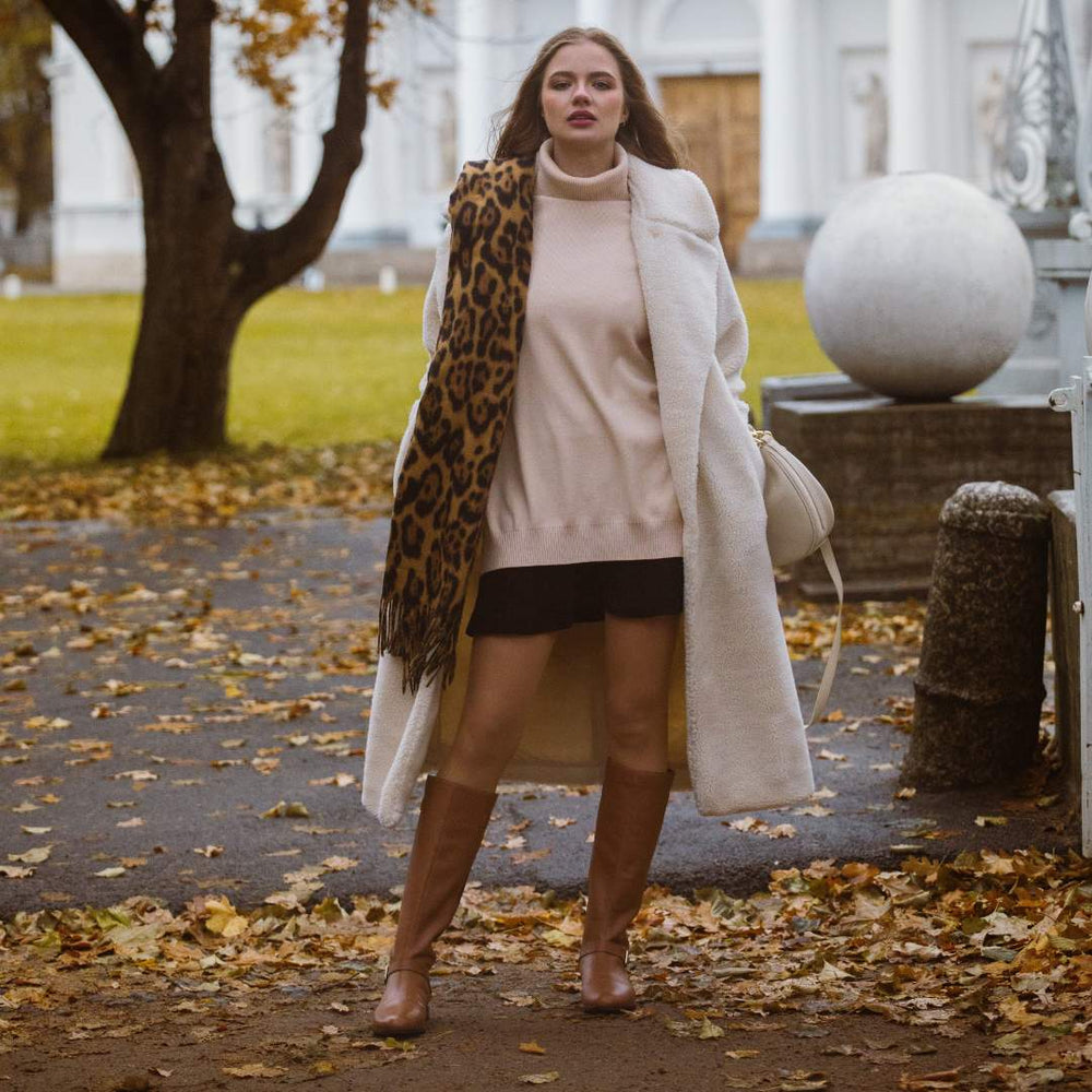 Women's tan leather knee high boots by Saint Delores, styled autumn lifestyle shot