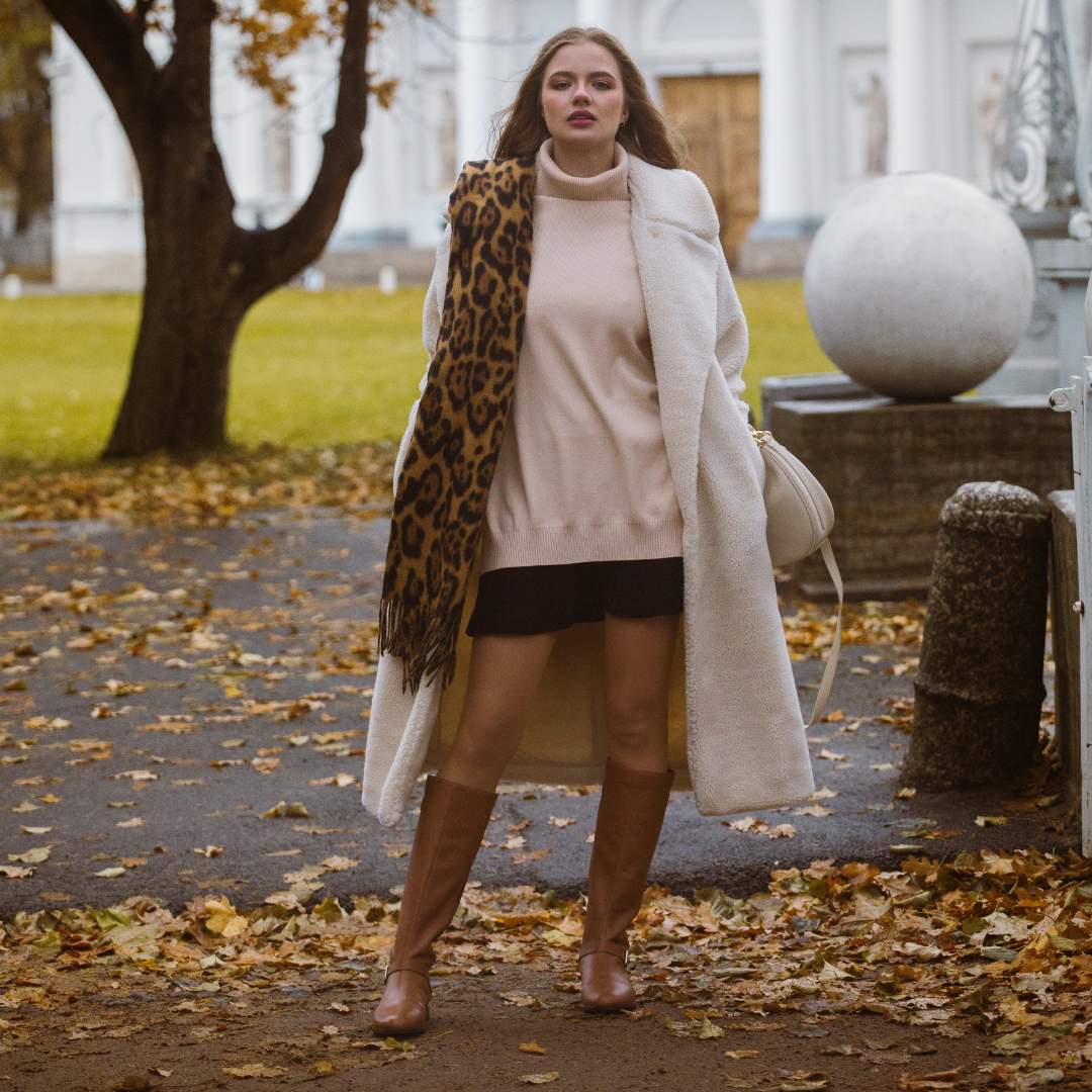 Women's tan leather knee high boots by Saint Delores, styled autumn lifestyle shot