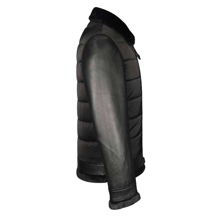 Back view of a man wearing a black quilted jacket with a fur collar.