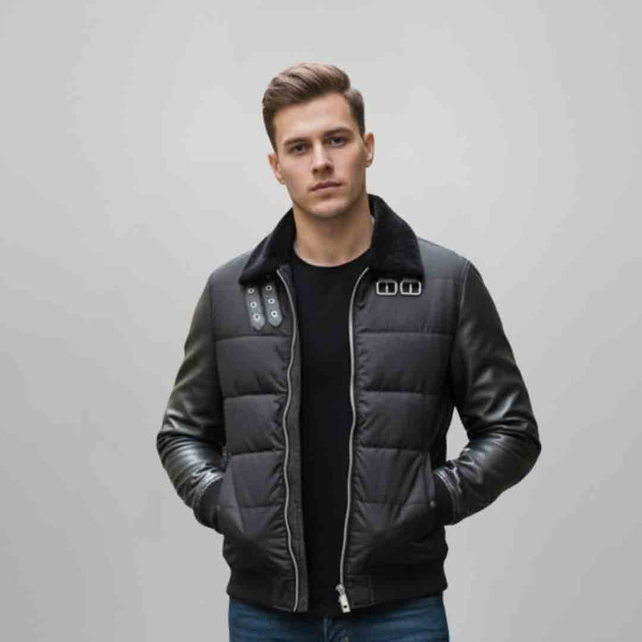 Man wearing a black quilted puffer-style jacket with a fur collar.
