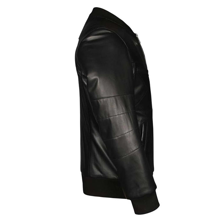 Close-up side view of a black leather bomber jacket's quilted sleeve panel.