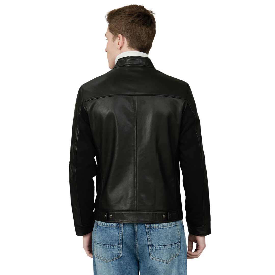 Back view of a man wearing a black leather jacket