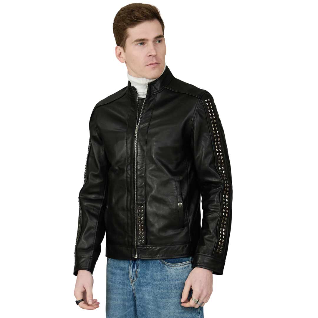 Man wearing a black leather jacket with a stand collar and studded sleeves