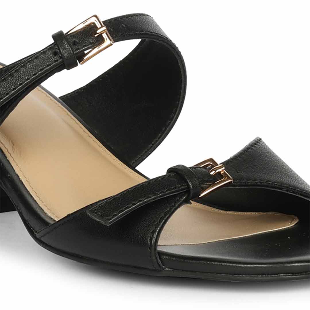 Close-up of buckle detail on Saint Ellery black leather low block heel sandals