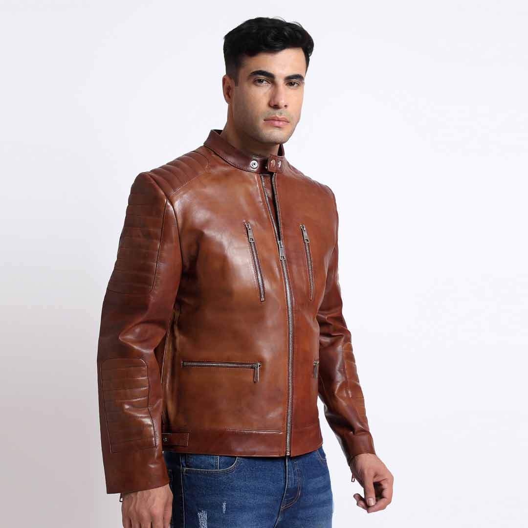 Side view of a man wearing a tan/cognac brown leather cafe racer jacket.