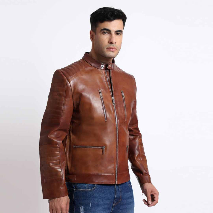 Side view of a man wearing a tan/cognac brown leather cafe racer jacket.
