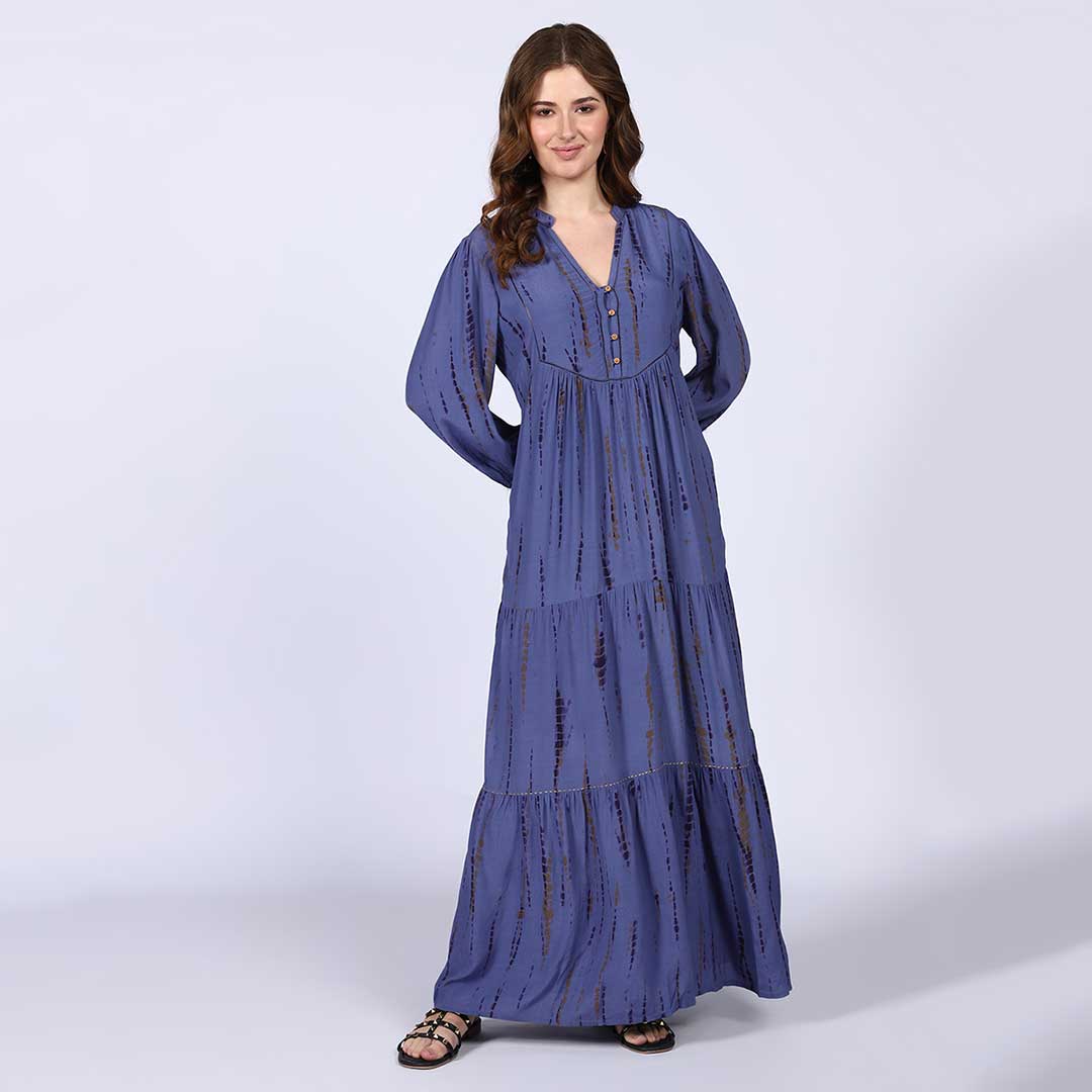 Women's midnight blue maxi dress by Saint Elodie, seated front view showing floor-length hem.
