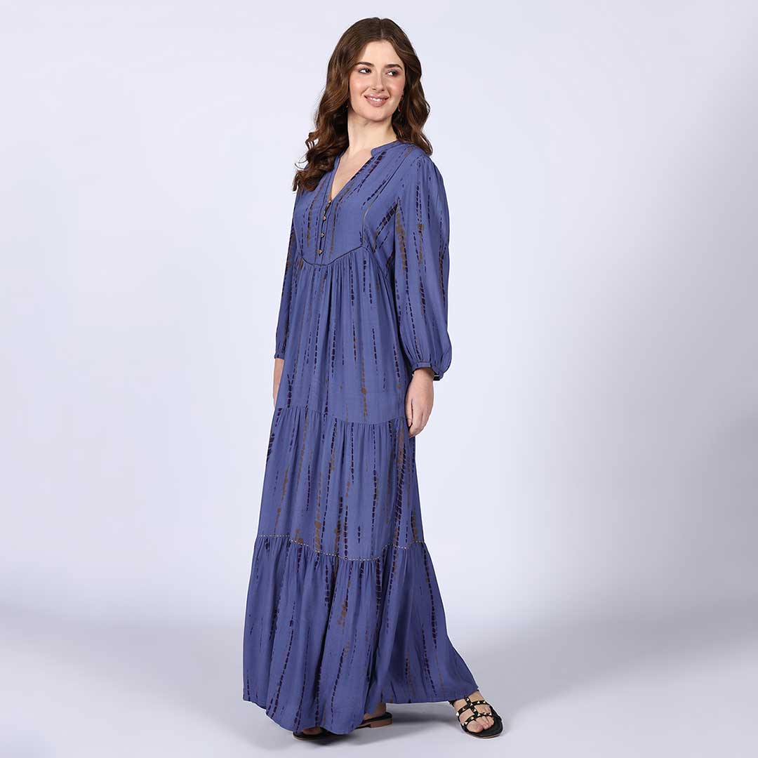Women's midnight blue maxi dress by Saint Elodie, side view showing full floor-length hem.