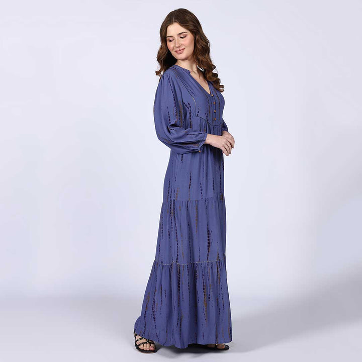 Women's midnight blue maxi dress by Saint Elodie, side view.