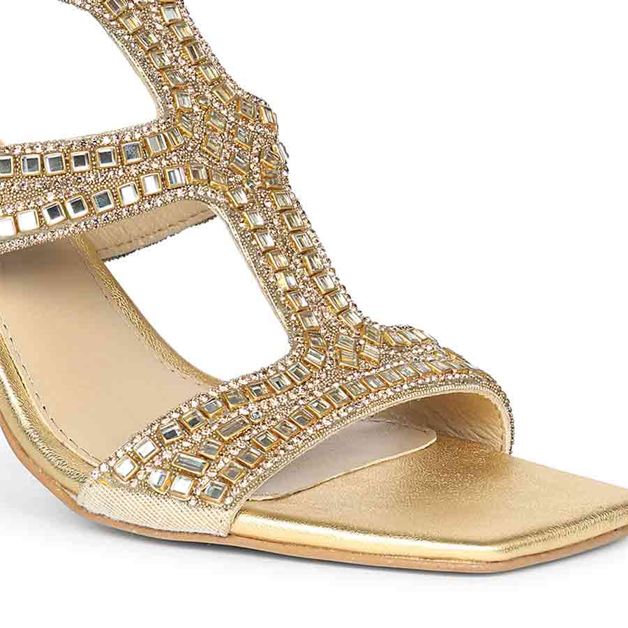 Close-up detail on Women's Saint Eloria Crystal Gold Leather Flared Stiletto Heels