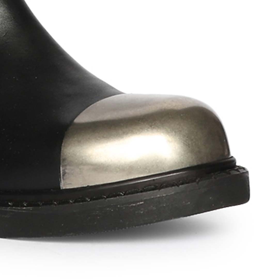 Close-up of gunmetal toe cap on Saint Ember black stretch napa long boots