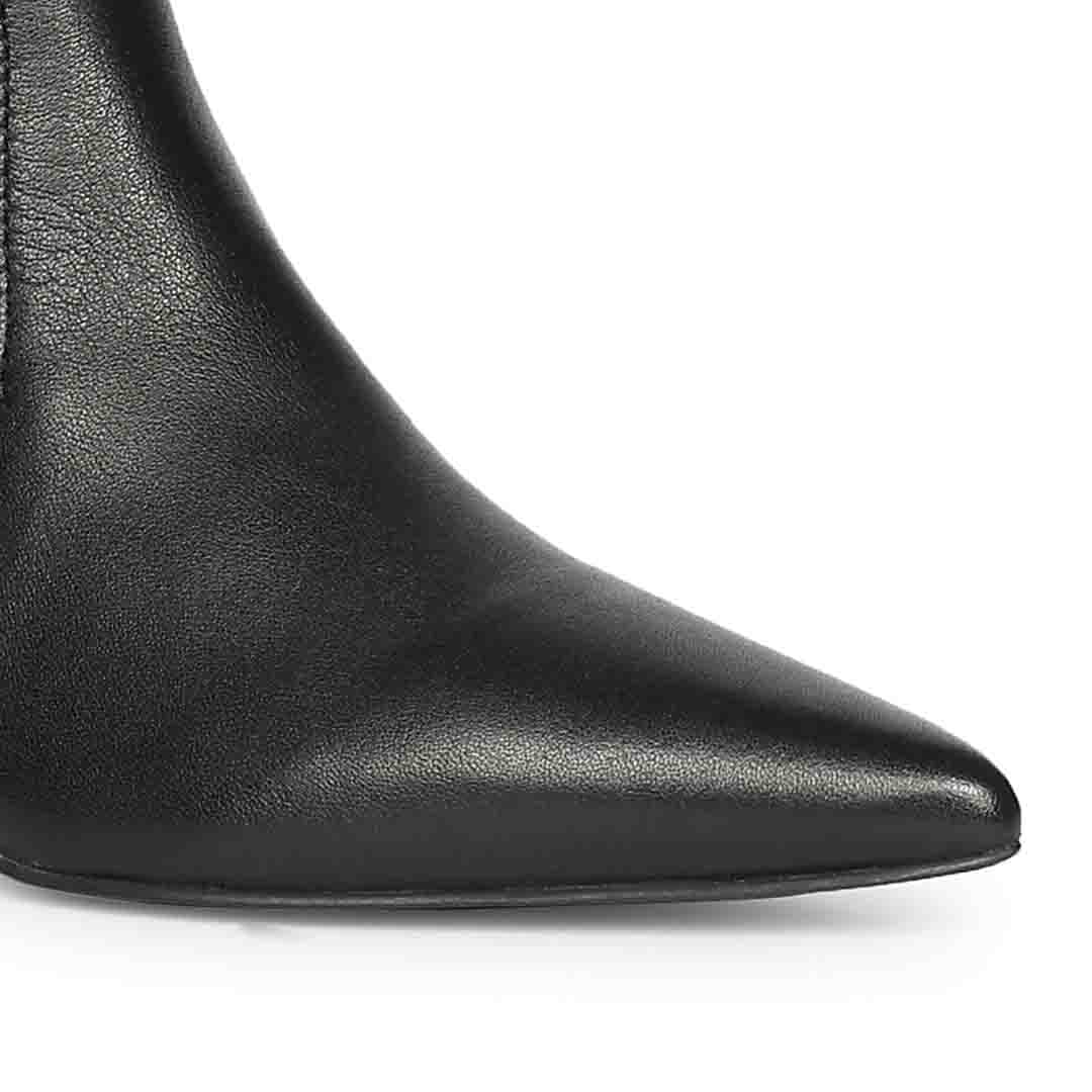 Close-up of pointed toe on Saint Emilia black stretch napa kitten heel boots