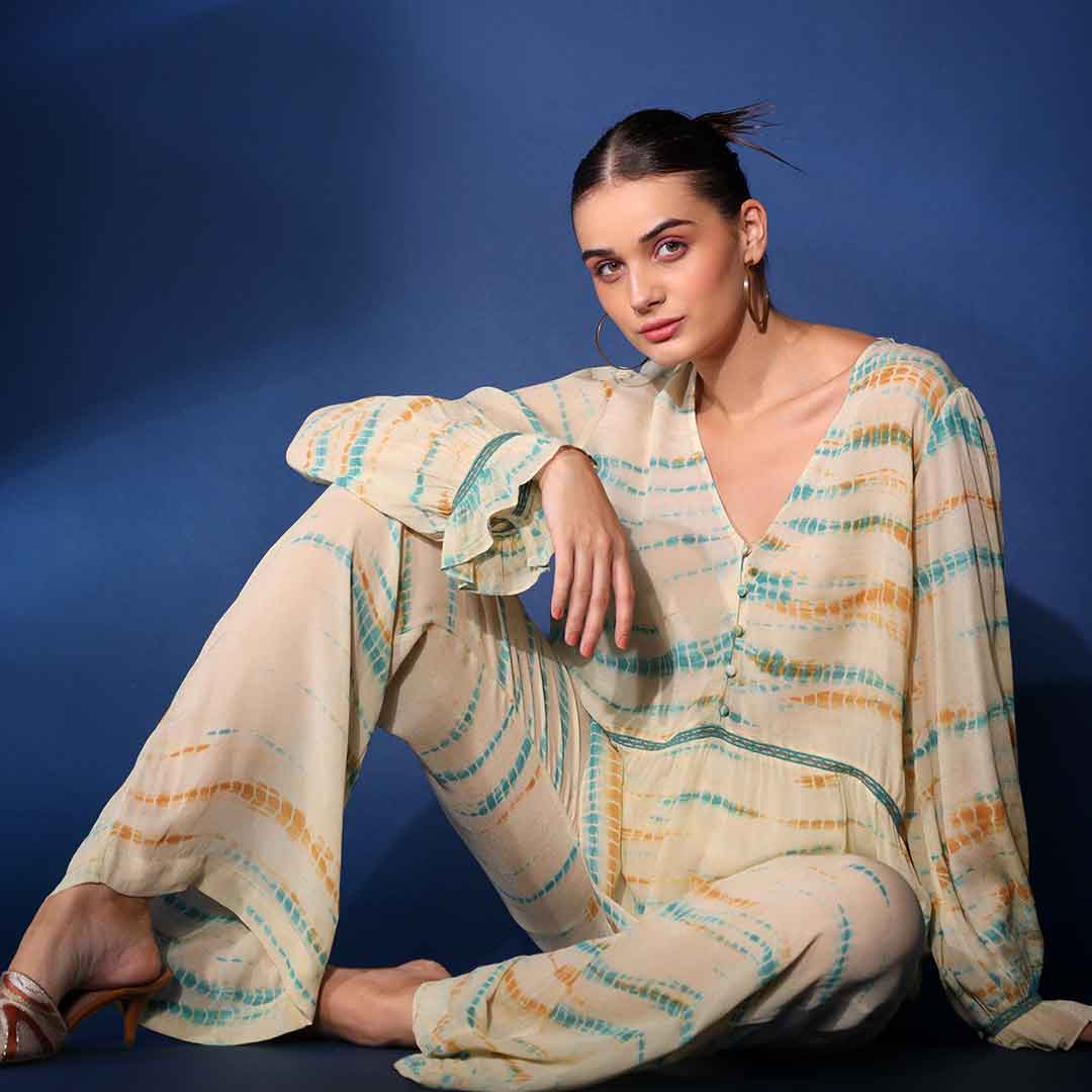 Women's multicolour tie-dye crepe top by Saint Emryn, seated lifestyle view.