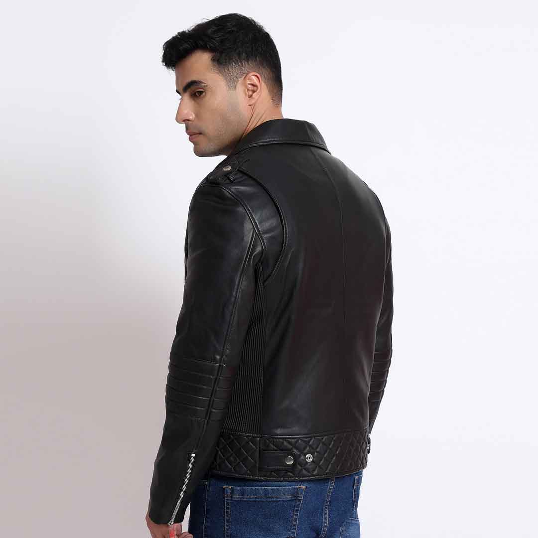 Back view of a man wearing a black leather biker jacket, looking over his shoulder.