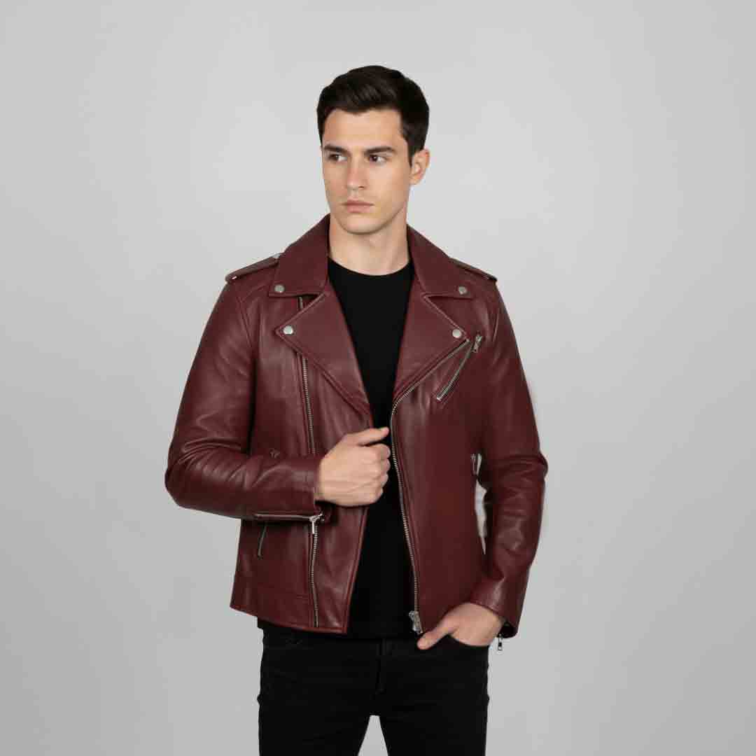 Man wearing an open burgundy leather biker-style jacket.
