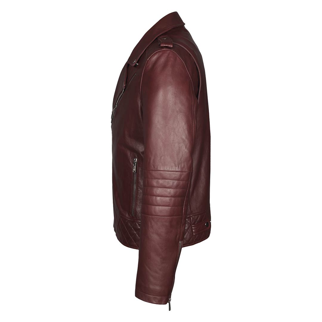 Full-length shot of a man wearing a burgundy leather biker-style jacket.