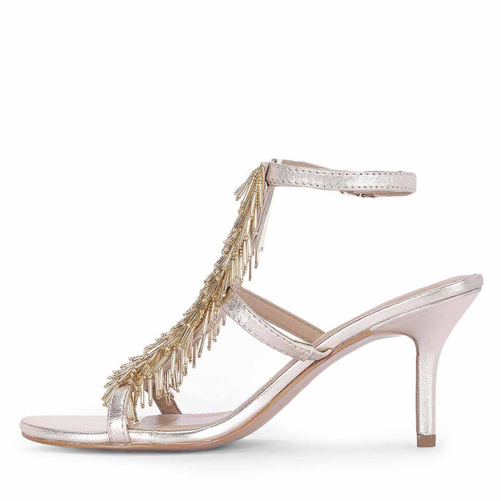 Women's Saint Faye Gold Leather Fringe Stilettos, angled view