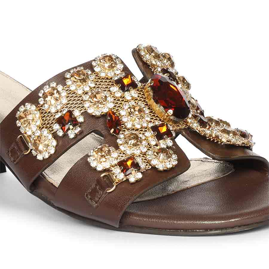 Close-up of stone embroidery on Saint Fiorenza brown leather low block heel mules