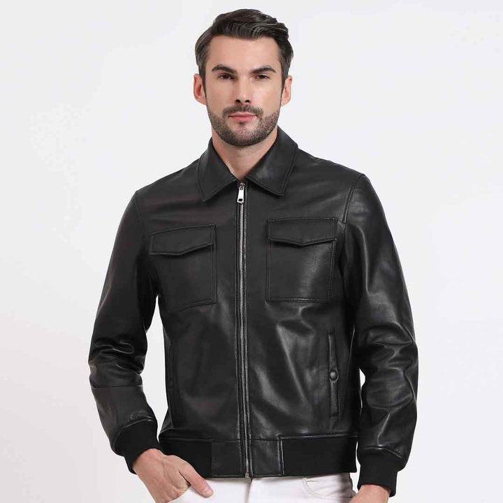 Man wearing an open black leather bomber-style jacket.