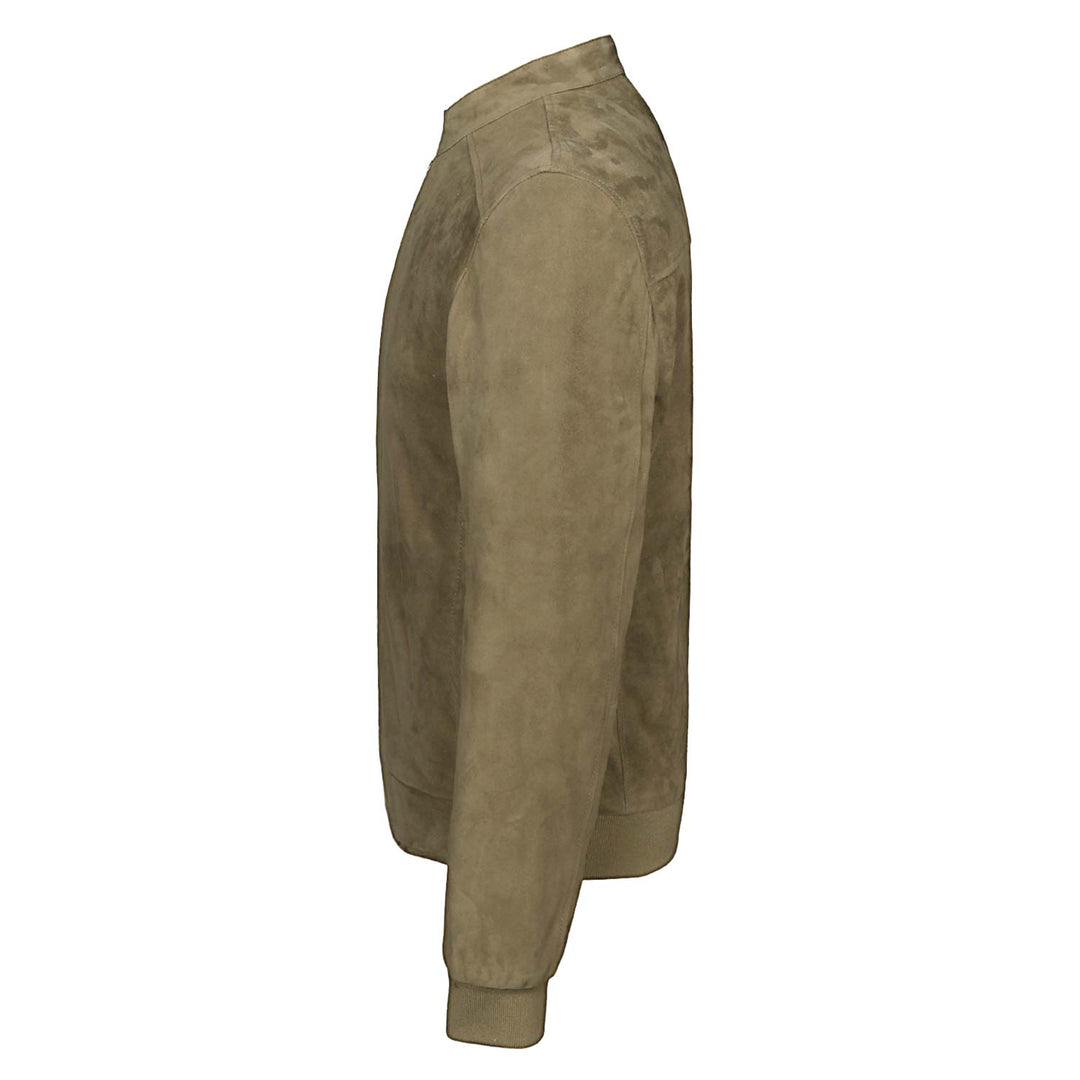 Side view of a man wearing a khaki/tan suede bomber-style jacket.